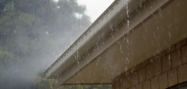 roof rain gutter during heavy rain