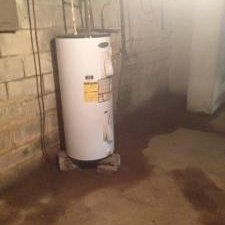 wet basement walls and floor a few days after basement flooding