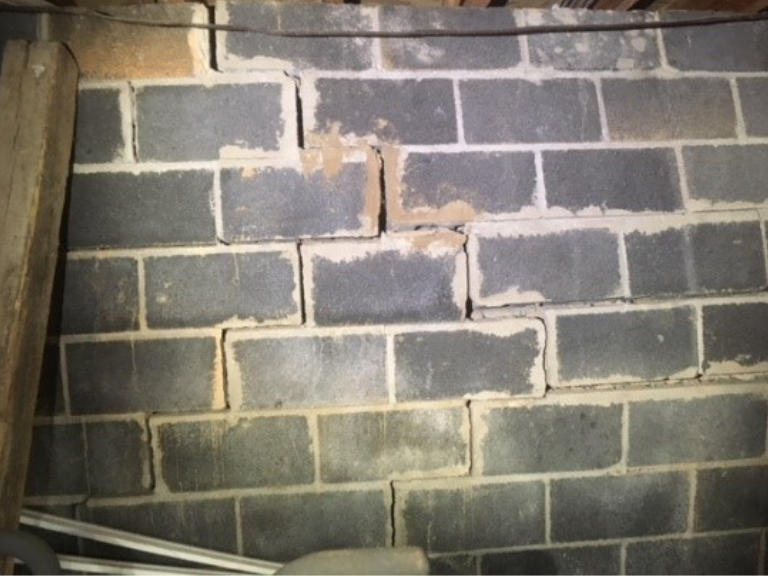 cracked bowing brick foundation wall