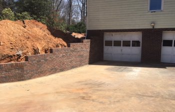 driveway brick retaining wall by Parks' Masonry