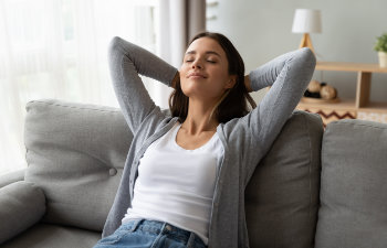 woman relaxes at home and breathes free
